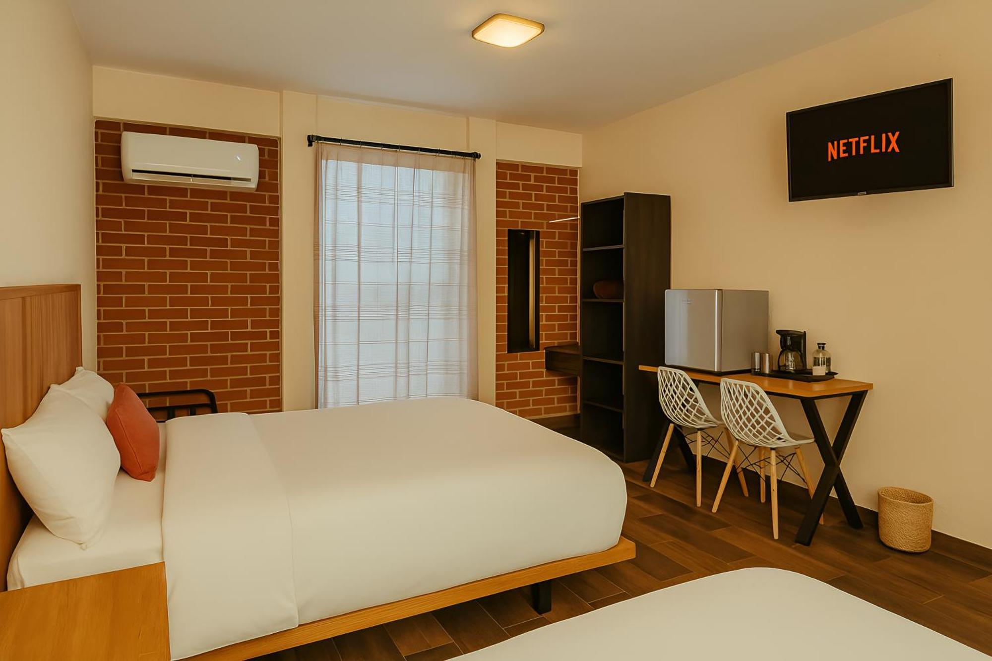 Habitación Doble Deluxe con cama supletoria