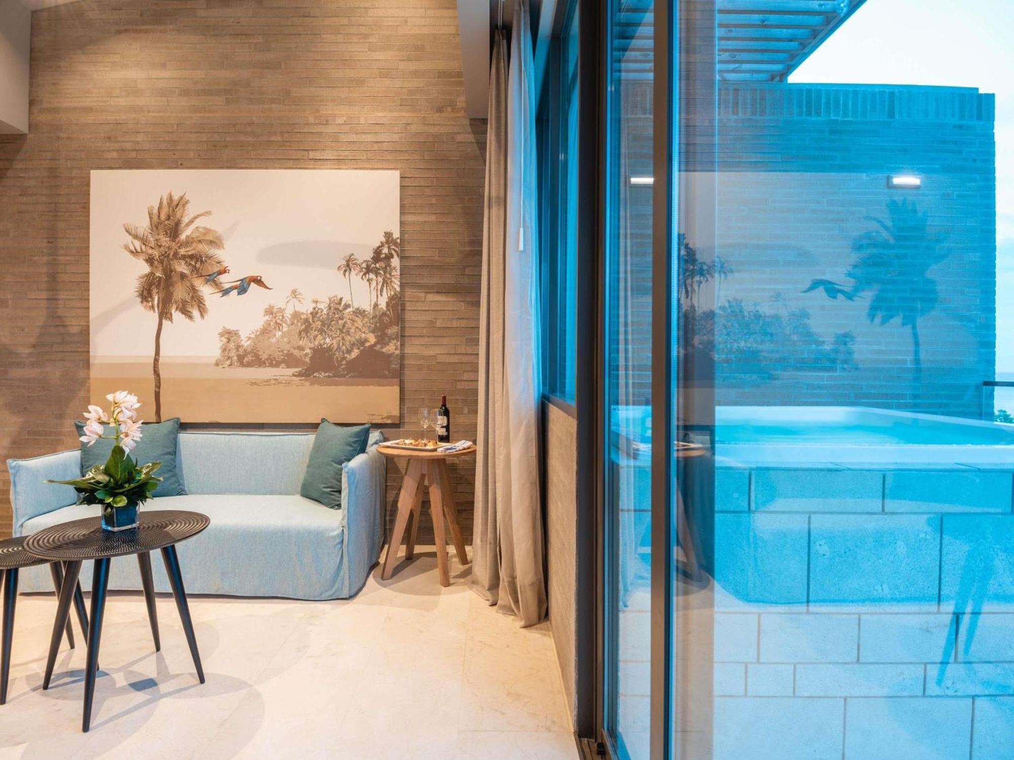 Ático familiar caribeño de 2 dormitorios con 1 cama grande, 2 camas individuales y vistas al mar