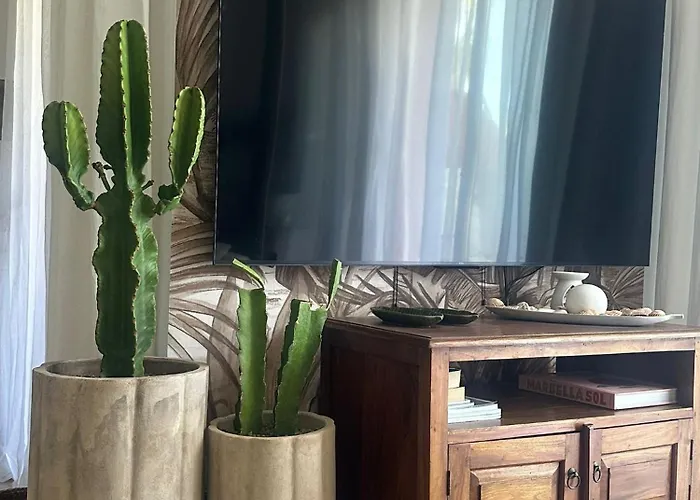 Estepona apartamento en planta baja con jardín privado y siete piscinas